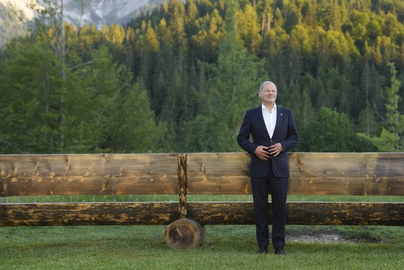 German Chancellor Olaf Scholz poses prior to a group photo of G7 leaders at the G7 summit at Castle Elmau in Kruen, near Garmisch-Partenkirchen, Germany, on Sunday, June 26, 2022. The Group of Seven leading economic powers are meeting in Germany for their annual gathering Sunday through Tuesday. (AP Photo/Markus Schreiber, Pool)