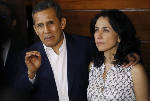 FILE - Peru&#039;s former President Ollanta Humala is accompanied by his wife Nadine Heredia as he speaks to reporters at the entrance of their home after they were released from prison in Lima, Peru, ...