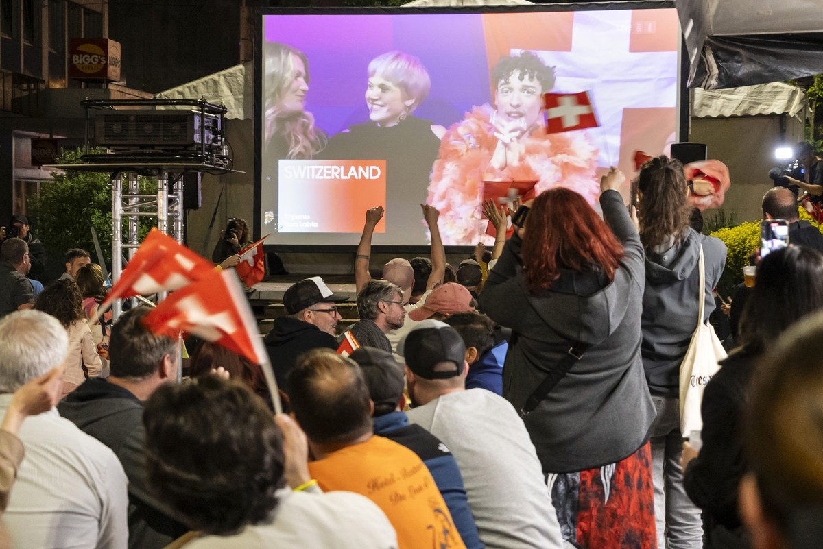 epa11334442 Supporters of singer Nemo, finalist of the 68th Eurovision Song Contest ESC, celebrate during a public viewing watching the broadcast of the ESC finals as Nemo is declared winner of the co ...