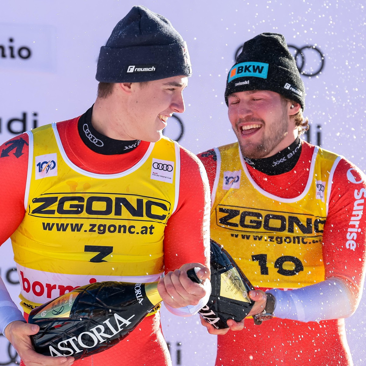 epa11795941 Second placed Franjo von Allmen (L) of Switzerland with his teammate winner Alexis Monney (R) celebrate on the podium after the Men's Downhill race at the FIS Alpine Skiing World Cup  ...