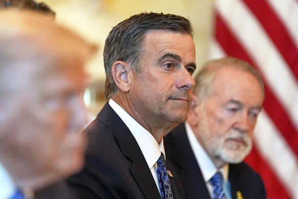 CIA Director John Ratcliffe, center, and U.S. Ambassador to Israel Mike Huckabee, right, listen as President Donald Trump, in foreground at left, meets with Israel's Prime Minister Benjamin Netan ...