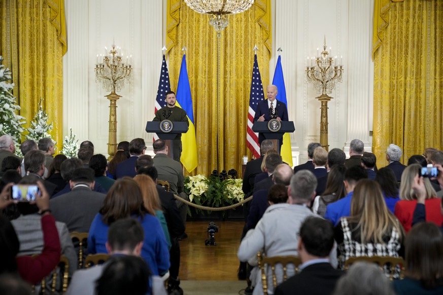 Ukrainian President Volodymyr Zelenskyy listens as President Joe Biden speaks at a news conference in the East Room of the White House in Washington, Wednesday, Dec. 1.  21, 2022. (AP Photo/Andrew Har...