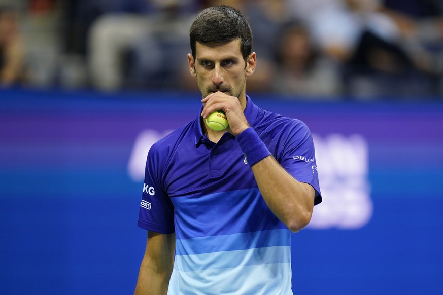 Novak Djokovic, of Serbia, pauses during a match against Tallon Griekspoor, of the Netherlands, during the second round of the US Open tennis championships, Thursday, Sept. 2, 2021, in New York. (AP P ...