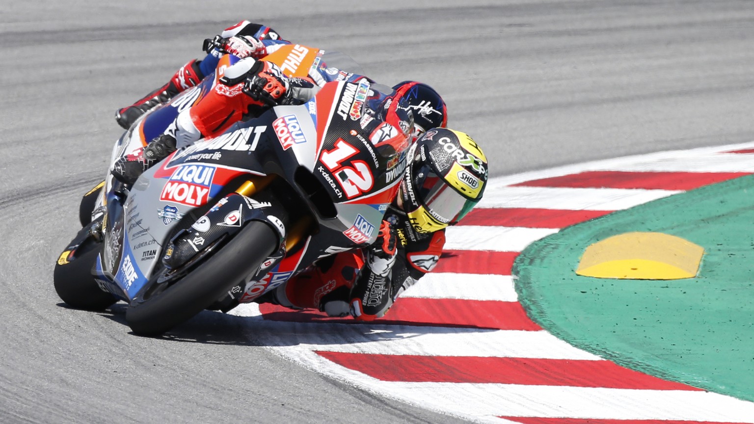 Moto2 rider Thomas Luthi of Switzerland leads Augusto Fernandez of Spain during the Catalunya Motorcycle Grand Prix at the Barcelona Catalunya racetrack in Montmelo, near Barcelona, Spain, on Sunday J ...