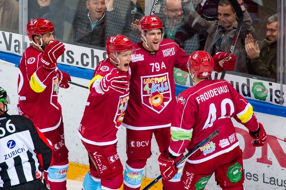 Lausanne&#039;s Joel Genazzi celebrates his goal on 3:0 with Etienne Froidevaux, Harri Pesonen and Eric Walsky, from right, during a National League A regular season game of the Swiss Championship bet ...