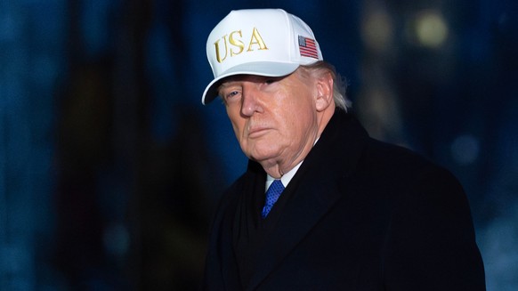 President Donald Trump walks on the South Lawn upon his arrival to the White House, Sunday, Feb. 1, 2026, in Washington. (AP Photo/Jose Luis Magana)
Donald Trump