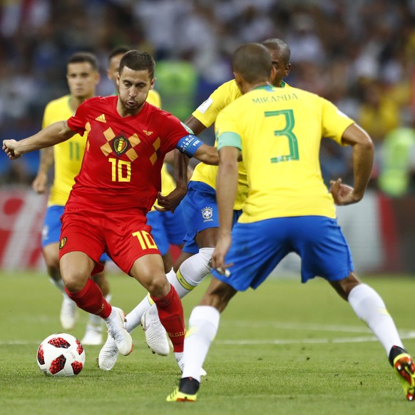 Belgium&#039;s Eden Hazard, left attempts to get past Brazil&#039;s Miranda during the quarterfinal match between Brazil and Belgium at the 2018 soccer World Cup in the Kazan Arena, in Kazan, Russia,  ...