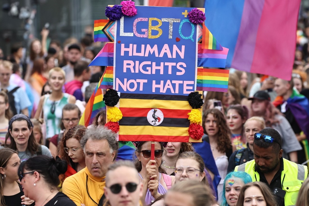 epa10762128 Participants move in front of the Brandenburg Gate (C) and the TV tower (L) during the 'CSD Berlin 2023' the 45th Christopher Street Day parade in Berlin, Germany, 22 July 2023.  ...