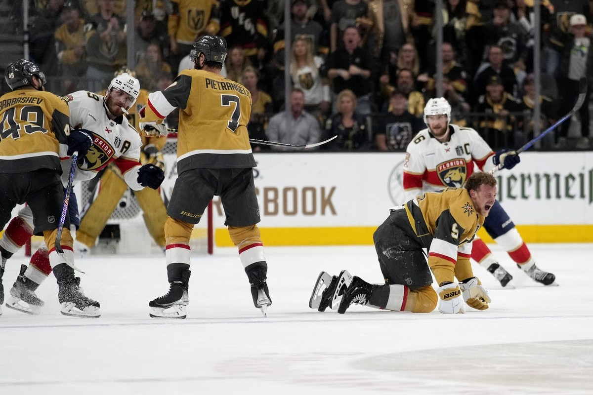 Vegas Golden Knights center Jack Eichel (9) yells after being hit by Florida Panthers left wing Matthew Tkachuk, left, during the second period of Game 2 of the NHL hockey Stanley Cup Finals, Monday,  ...