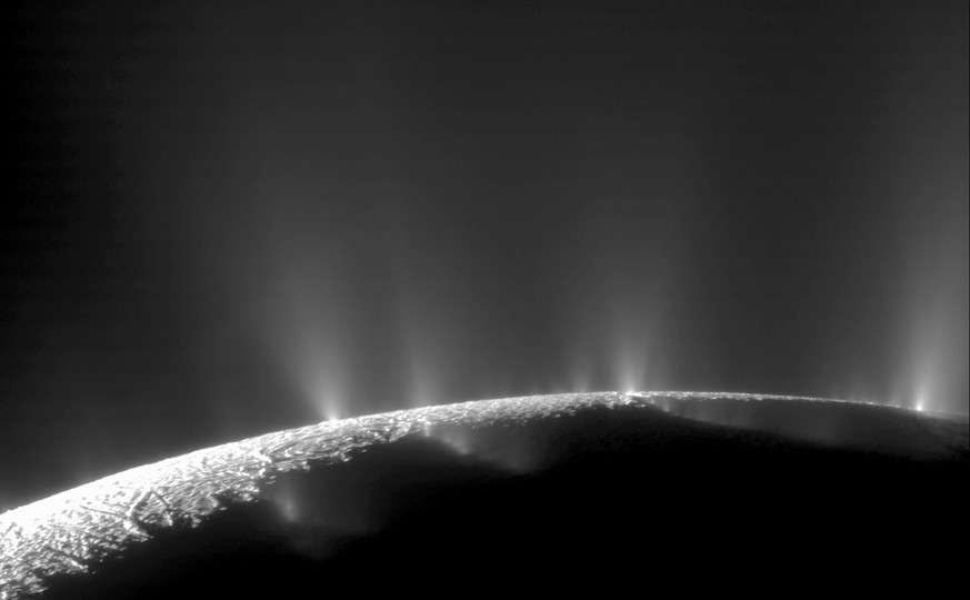 This Feb. 17, 2005 image made available by NASA shows plumes of water ice and vapor from the south polar region of Saturn's moon Enceladus. The activity is understood to originate from the moon&# ...