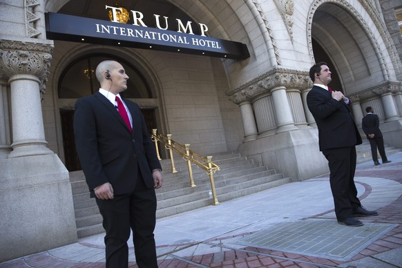 epa05536854 Hotel security in front of the new Trump International Hotel on Pennsylvania Avenue in Washington, DC, USA, 12 September 2016. The Trump International Hotel opens today, with its grand ope ...