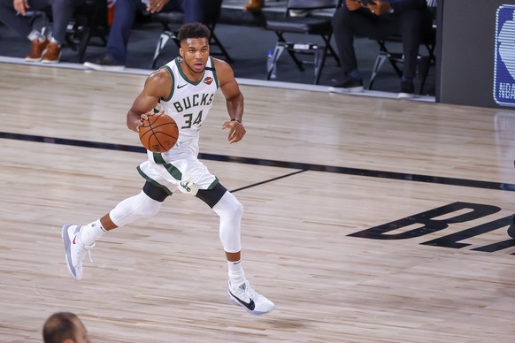 epa08634616 Milwaukee Bucks forward Giannis Antetokounmpo of Greece in action against the Orlando Magic during the first quarter of the NBA basketball first-round playoff game five at the ESPN Wide Wo ...