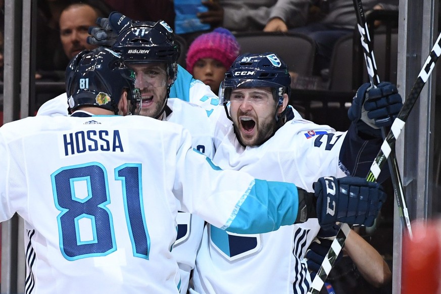 Team Europe&#039;s Tomas Tatar, right, celebrates his goal against Team Sweden with teammates Marian Hossa (81) and Anze Kopitar, center, during third-period World Cup of Hockey semifinal action in To ...