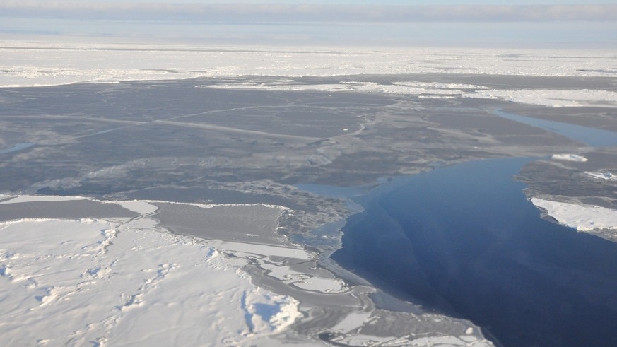 This 2014 photo provided by NOAA shows the Arctic ice coverage. Earth&#039;s icy northern region lost more of its signature whiteness that reflects the sun&#039;s heat. It was replaced temporarily wit ...