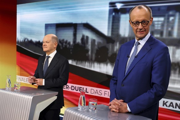 Olaf Scholz, German Chancellor of the Social Democratic Party (SPD), left, and Friedrich Merz, right, leader of the Christian Democratic Union (CDU), are pictured in tv studio ahead of a debate in Ber ...