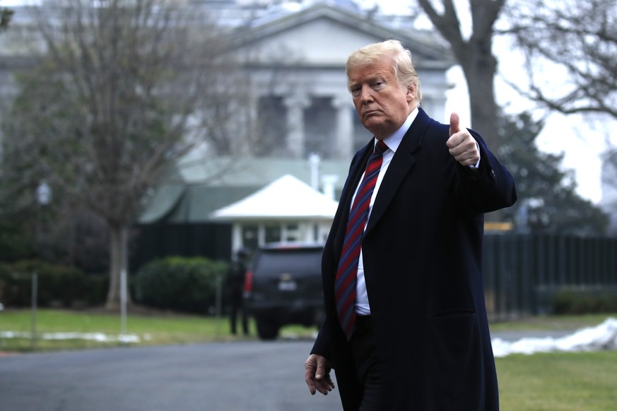 President Donald Trump walks on the South Lawn upon arrival at the White House in Washington, Saturday, Jan. 19, 2019, after attending the casualty return at Dover Air Force Base, Del., for the remain ...