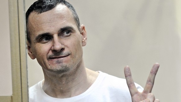 FILE - In this Tuesday, Aug. 25, 2015 file photo, Oleg Sentsov gestures as the verdict is delivered, as he stands behind bars at a court in Rostov-on-Don, Russia. The lawyer for a hunger-striking Ukra ...