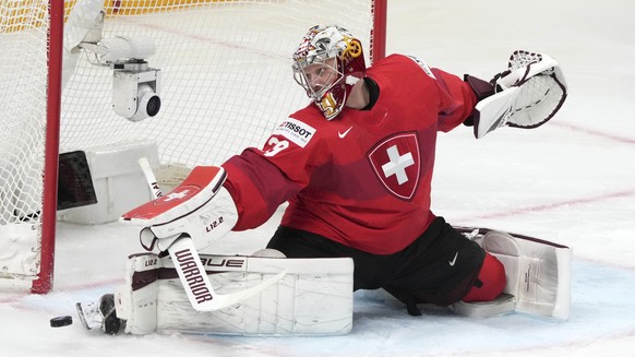 Goalie Robert Mayer of Switzerland in action during the quarter final match between Germany and Switzerland at the ice hockey world championship in Riga, Latvia, Thursday, May 25, 2023. (AP Photo/Roma ...