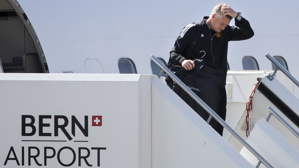 Manchester United's head coach Ole Gunnar Solskjaer disembarks from the plane upon his team's arrival at the airport in Bern-Belp, Switzerland, 13 September 2021. Manchester United will face ...