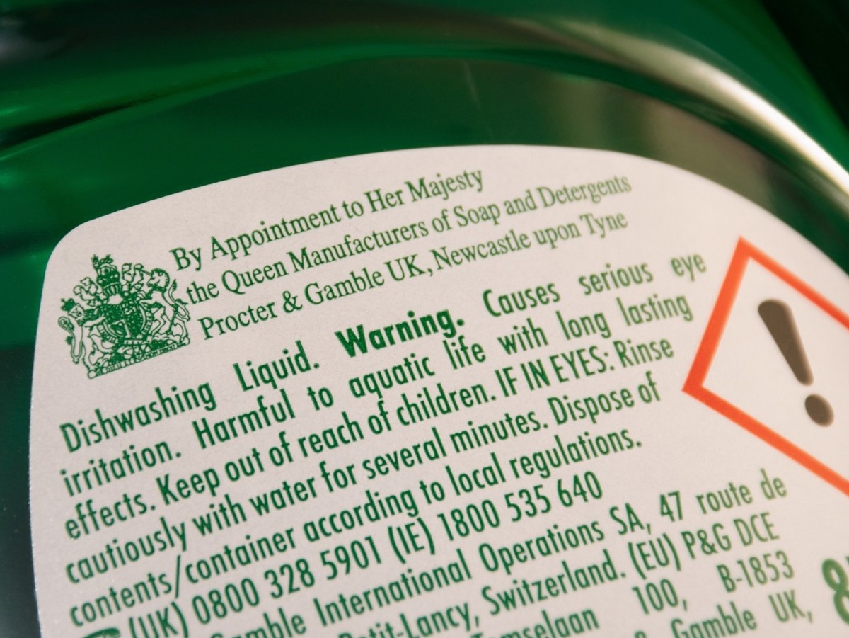 Guildford, UK - September 13, 2022: The Royal Warrant of Appointment on a bottle of Fairy dishwashing liquid. Supplier of goods or services to Royal personages. By appointment to HM The Queen.