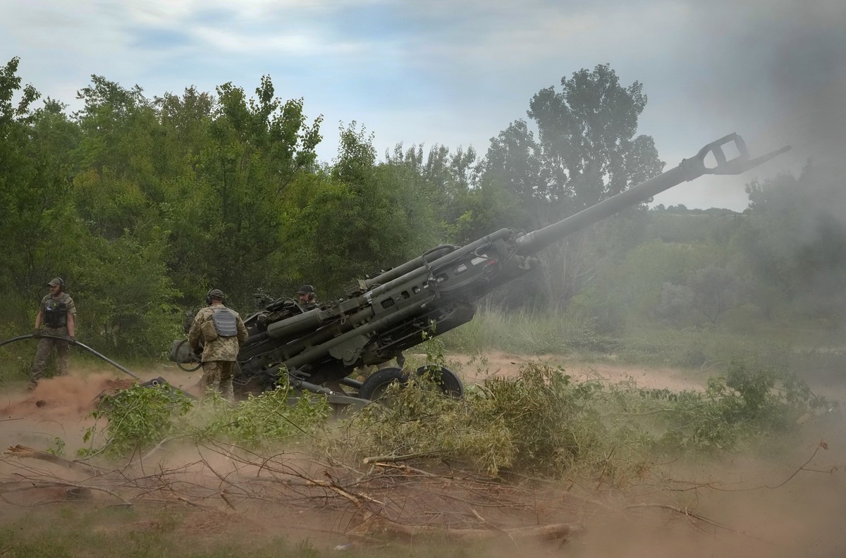 FILE - Ukrainian soldiers fire at Russian positions from a U.S.-supplied M777 howitzer in Ukraine's eastern Donetsk region, June 18, 2022. The deliveries of Western weapons have been crucial for  ...