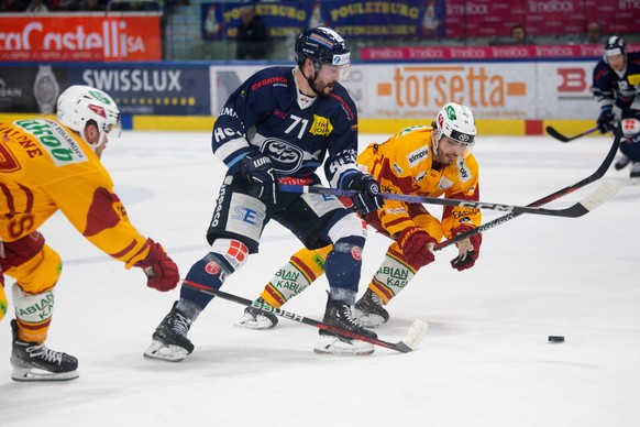 From left, Tiger&#039;s player Sean Malone, Ambri&#039;s player Jesse Virtanen and, Miro Zryd, during the preliminary round game of National League A (NLA) Swiss Championship 2023/24 between, HC Ambri ...
