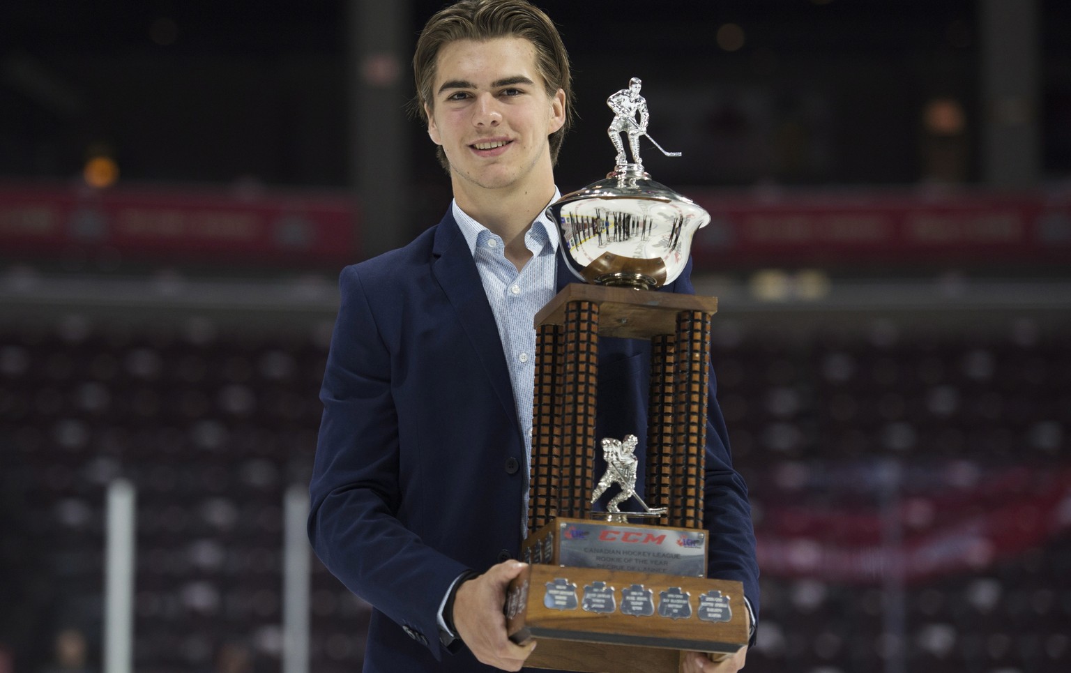 CHL Rookie of the Year Award recipient Nico Hischier, from the Halifax Mooseheads, holds his trophy following a media availability at the Memorial Cup Saturday, May 27, 2017, in Windsor, Ontario. (Adr ...