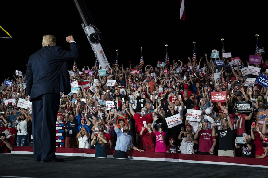 President Donald Trump pumps his fist as he walks off after speaking at a campaign rally at Orlando Sanford International Airport, Monday, Oct. 12, 2020, in Sanford, Fla. (AP Photo/Evan Vucci)
Donald ...