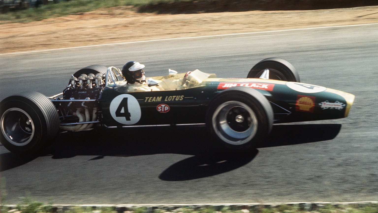 FILE - In this Jan. 1, 1968 file photo two-time world champion driver Jim Clark of Scotland drives his Lotus 49 during the South African Grand Prix at Kyalami circuit. Lotus is returning to Formula On ...