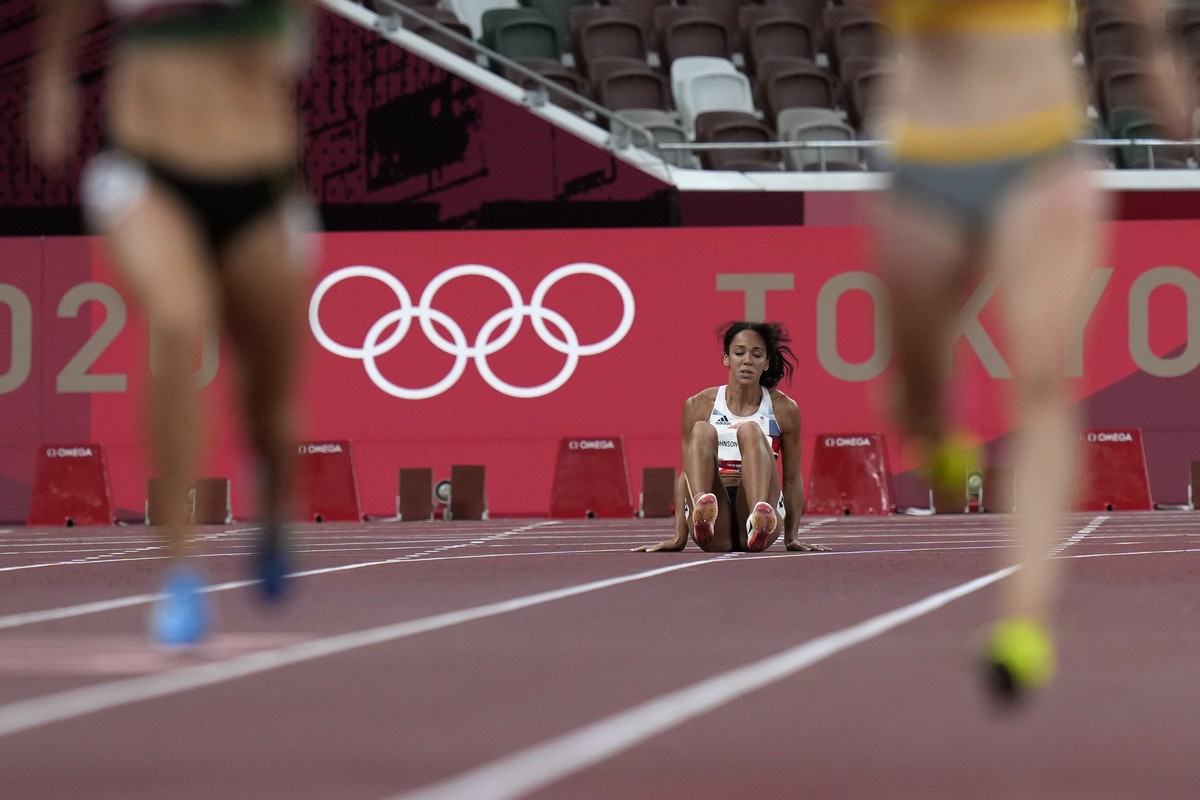 Katarina Johnson-Thompson, of Britain, reacts after dropping to the track during a heat in the heptathlon women's 200-meter at the 2020 Summer Olympics, Wednesday, Aug. 4, 2021, in Tokyo. (AP Pho ...