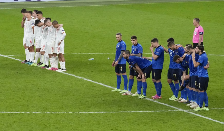 Teams line up for the penalty shoot out during the Euro 2020 soccer championship semifinal between Italy and Spain at Wembley stadium in London, Tuesday, July 6, 2021. (AP Photo/Matt Dunham,Pool)