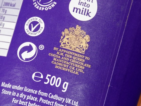 Guildford, UK - September 10, 2022: The Royal Warrant of Appointment on a tin of Cadbury Hot Chocolate Cocoa Powder. Supplier of goods or services to Royal personages. By appointment to HM The Queen.