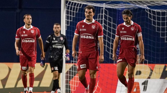 Thuns Nicolas Buergy, Thuns Valmir Matoshi and Thuns Jan Bamert look dejected after Zagreb scores to make it 1-2 during the UEFA Champions League second qualifying round match between Croatia' ...