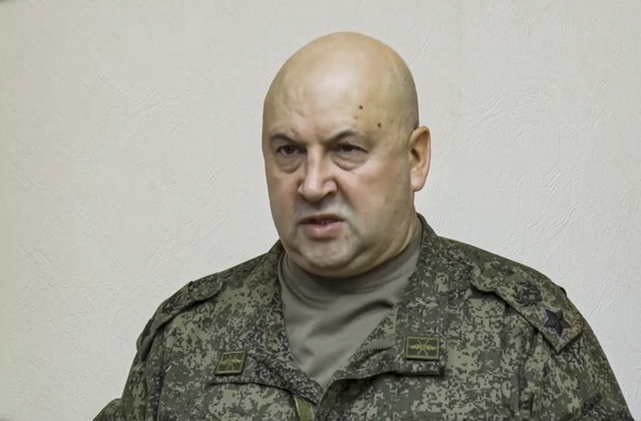 epa10296351 A handout still image taken from a handout video provided by the Russian Defence ministry press-service shows General of the Army Sergei Surovikin, commander of the joint group of troops i ...
