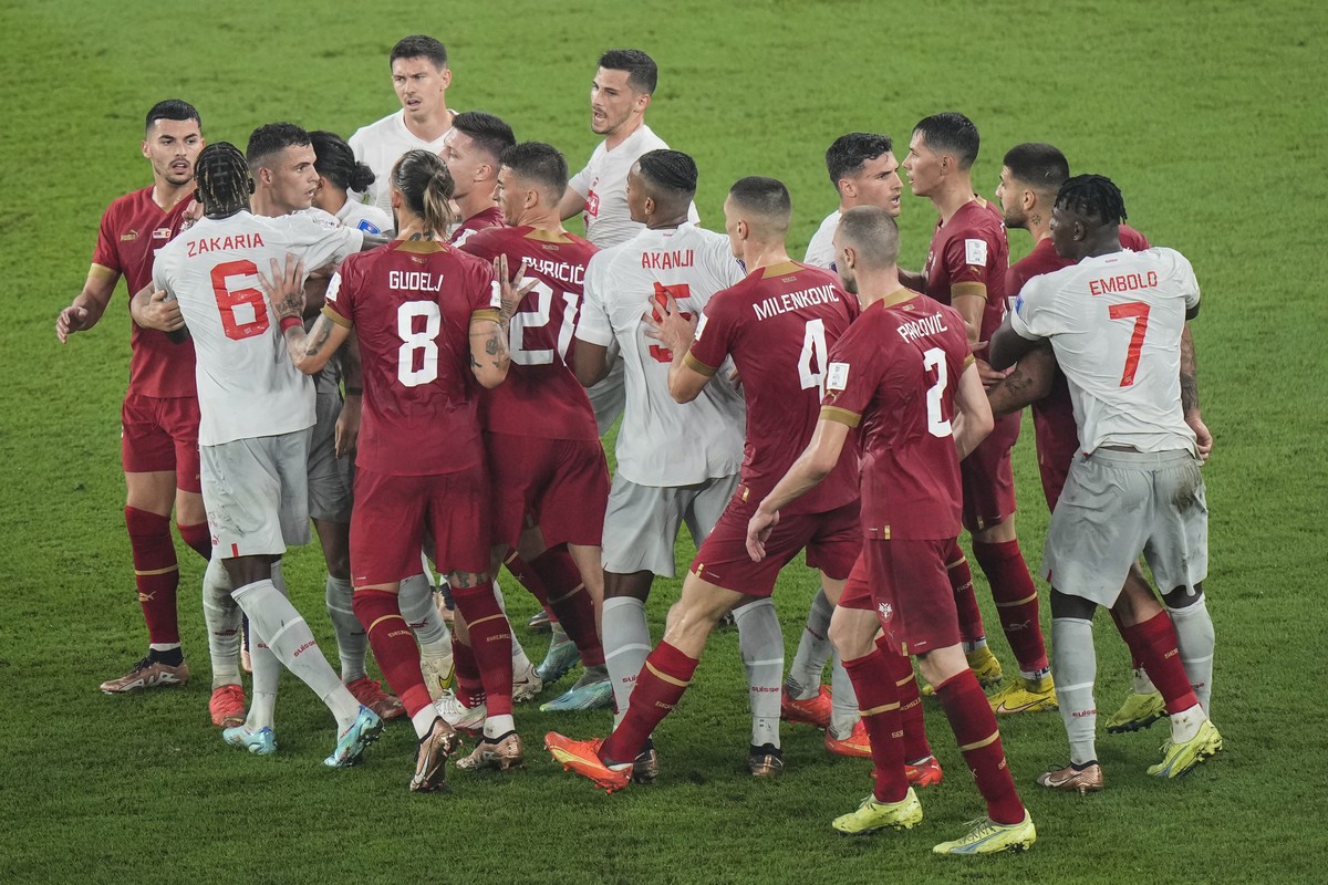 Switzerland's and Serbia's players, in red, argue during the World Cup group G soccer match between Serbia and Switzerland, at the Stadium 974 in Doha, Qatar, Friday, Dec. 2, 2022. (AP Photo ...