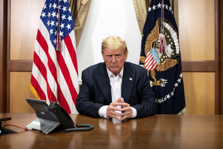 In this image provided by the White House, President Donald Trump listens during a phone call with Vice President Mike Pence, Secretary of State Mike Pompeo, and Chairman of the Joint Chiefs of Staff  ...