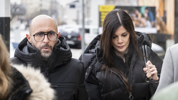 epa12726288 The owners of 'Le Constellation' bar in Crans-Montana, Jacques, (L), and Jessica Moretti of France, arrive to a hearing before the public prosecutor of the canton of Valais, foll ...