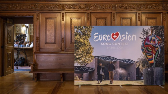 epa11573201 A poster with the Eurovision Song Contest (ESC) logo stands in the town hall in Basel, Switzerland, 30 August 2024. The Eurovision Song Contest 2025 will be held in Basel. EPA/GEORGIOS KEF ...