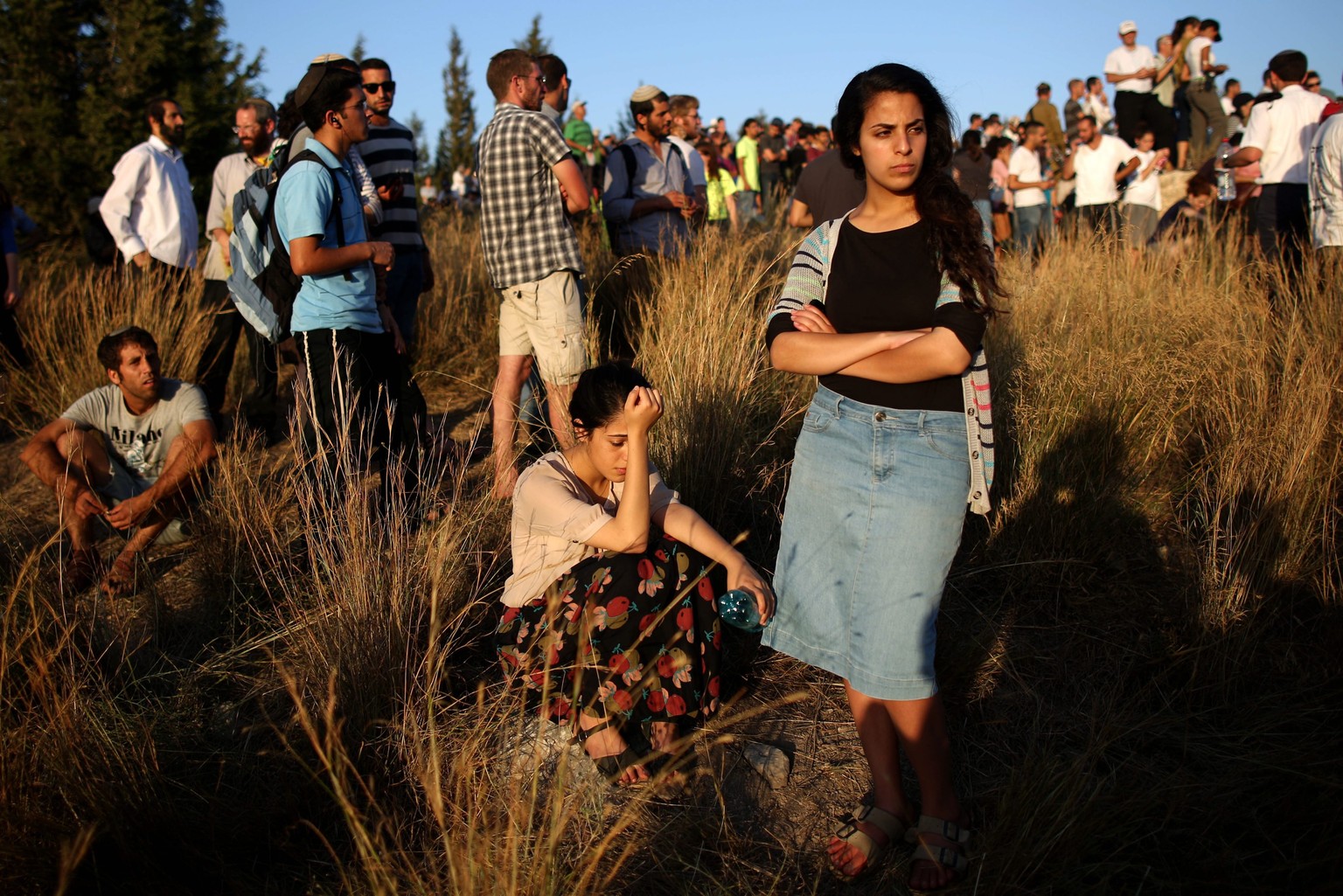 epa04294383 People attend the funeral of the three Israeli teens who were abducted and killed in the West Bank, during their joint funeral in the Israeli city of Modi&#039;in, 01 July 2014. Tens of th ...