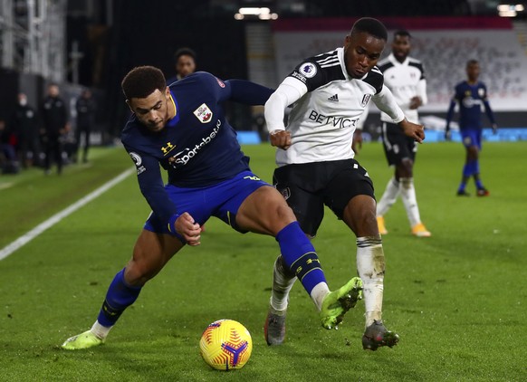 Fulham&#039;s Ademola Lookman, right, duels for the ball with Southampton&#039;s Che Adams during the English Premier League soccer match between Fulham and Southampton at the Craven Cottage stadium i ...
