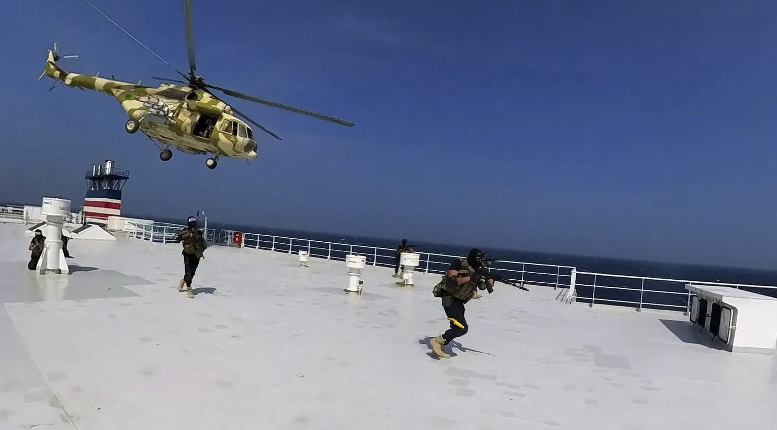 This photo released by the Houthi Media Center shows Houthi forces boarding the cargo ship Galaxy Leader on Sunday, Nov. 19, 2023. Yemen&#039;s Houthis have seized the ship in the Red Sea off the coas ...