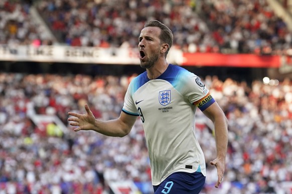 England&#039;s Harry Kane celebrates after scoring the opening goal during the Euro 2024 group C qualifying soccer match between England and North Macedonia at Old Trafford in Manchester, Monday June  ...