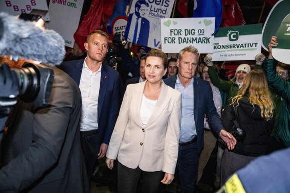 epa12779478 Danish Prime Minister and Social Democrats leader Mette Frederiksen (C) arrives for a party leader debate hosted by DR (Danmarks Radio) in Copenhagen, Denmark, 26 February 2026. Frederikse ...