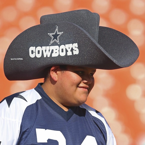 MIAMI GARDENS, FL - AUGUST 23: A young fan shows his support for the Dallas Cowboys before they play against the Miami Dolphins in a preseason game at Sun Life Stadium on August 23, 2014 in Miami Gard ...