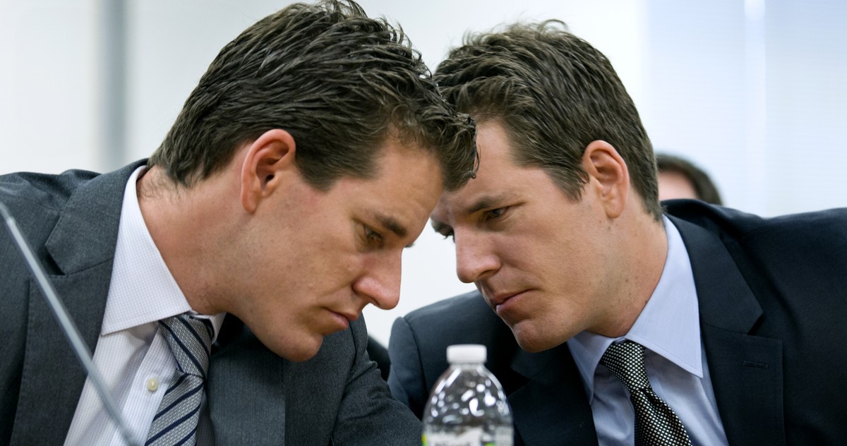 Brothers Cameron, left, and Tyler Winklevoss, Principals of Winklevoss Capital Management, share a word during a hearing called "The Investor Perspective: The Future of Virtual Currencies" i ...