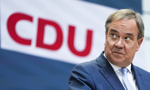 FILE - In this Monday, Sept. 27, 2021 file photo, candidate for chancellor of the Christian Union parties Armin Laschet brief the media after a leaders meeting of his Christian Democratic Union party  ...