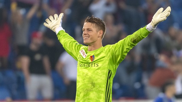Basel's goalkeeper Jonas Omlin cheers after the UEFA Champions League second qualifying round second leg match between Switzerland's FC Basel 1893 and Netherland's PSV Eindhoven in the  ...