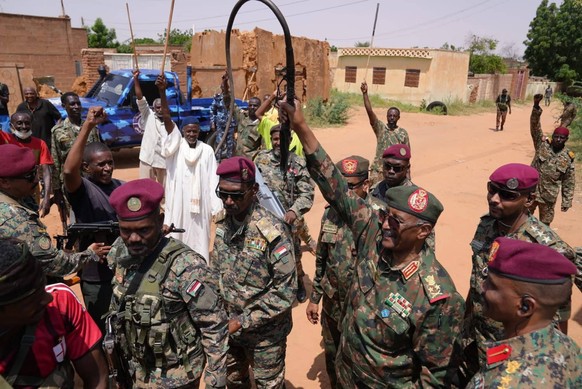 250928 -- EL OBEID, Sept. 28, 2025 -- This photo taken with a mobile phone on Sept. 27, 2025 shows Chairman of Sudan s Transitional Sovereign Council and Commander of the Sudanese Armed Forces SAF Abd ...