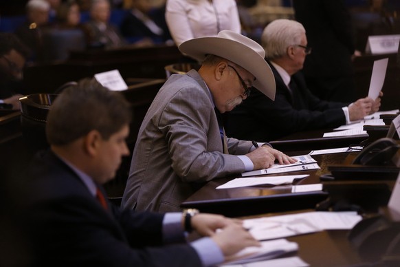 Electoral College member Richard Jones signs his ballot in Columbus, Ohio, Monday, Dec. 19, 2016. All 18 of Ohio&#039;s Electoral College members voted Monday for Republican Donald Trump despite oppos ...