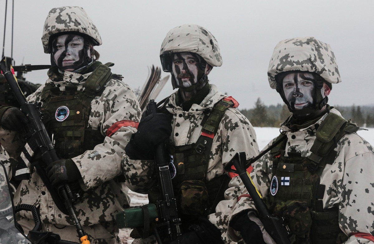 Finnish soldiers in their winter camouflage attend the NATO arctic exercises Cold Response 26 at the in Rovajarvi Training Area in Rovaniemi, Finland, Tuesday, March 17, 2026. (AP Photo/Aino Vaananen) ...